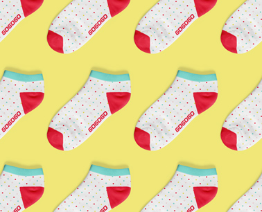 Multiple Socks on a Yellow Background