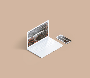 MacBook und ein iPhone auf beigem Hintergrund