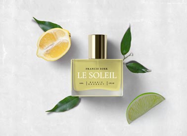 Parfümflasche mit geschnittenen Zitronen