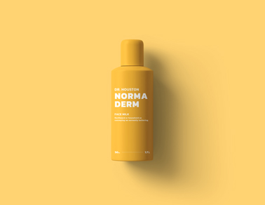 Frasco de Cosmético em uma Superfície Amarela