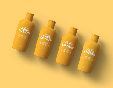 Quatro Frascos de Loção em um Fundo Amarelo
