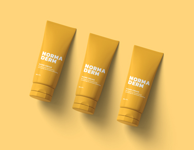 Três Tubos de Creme em uma Superfície Amarela