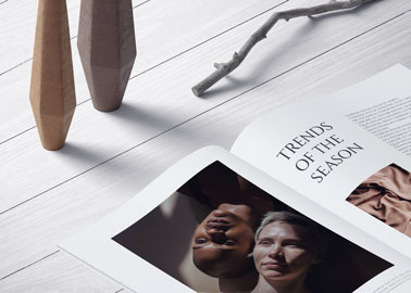 An Open Magazine on a Wooden Surface