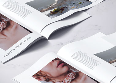 Two Magazines on a Marble Surface