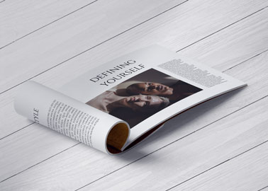 A Folded Magazine on a Wooden Surface