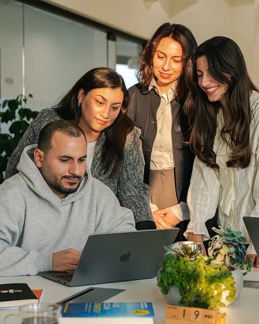 Teammates reviewing work together