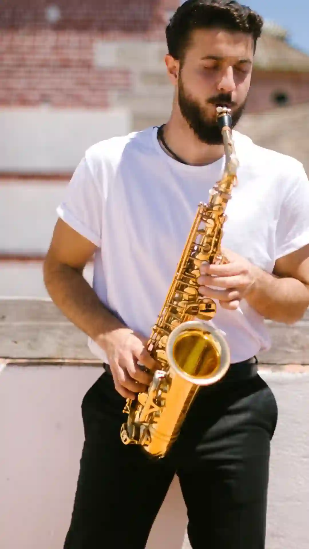 Saxophonist on a rooftop