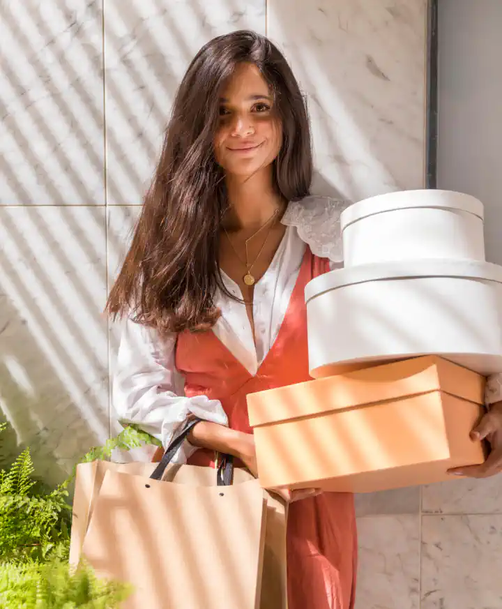 Seller holding product boxes