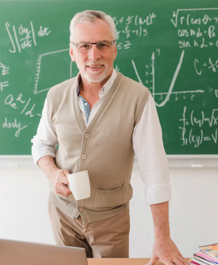Teacher at a chalkboard