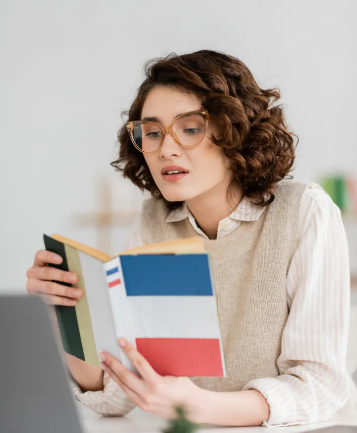 Translator reading a French book